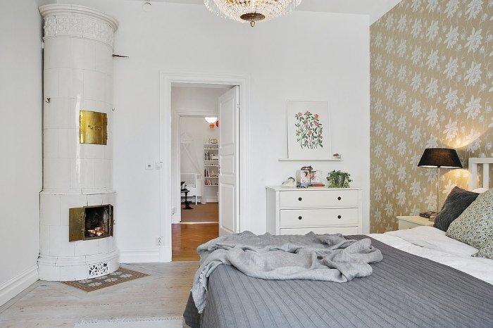 Scandinavian bedroom with fireplace - creating cozy and memorable moments
