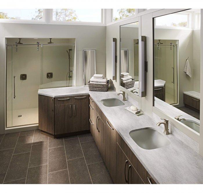 American bathroom with Corian countertops - with two sinks and mirros