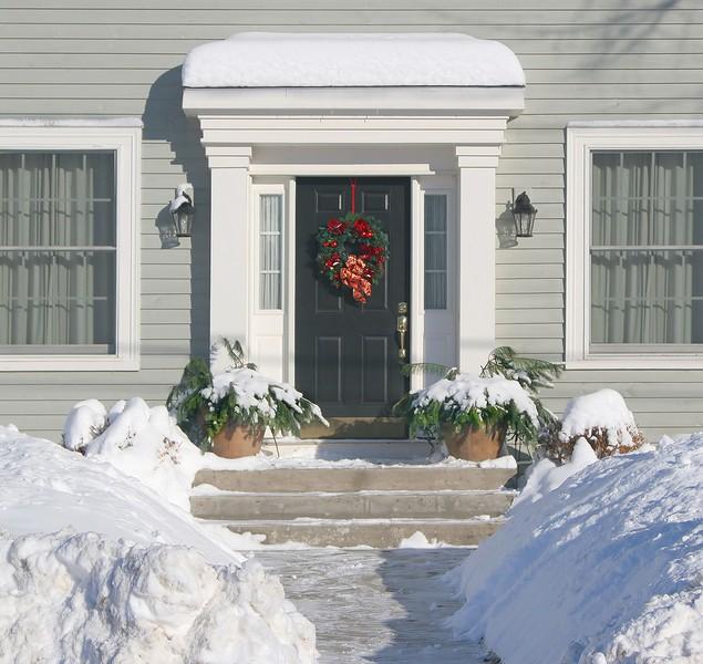 Front door with red Christmas wreath