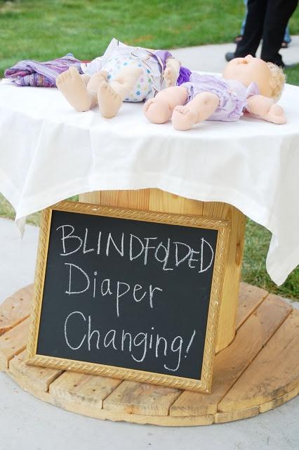Outdoor baby shower decor - blindfolded diaper changing