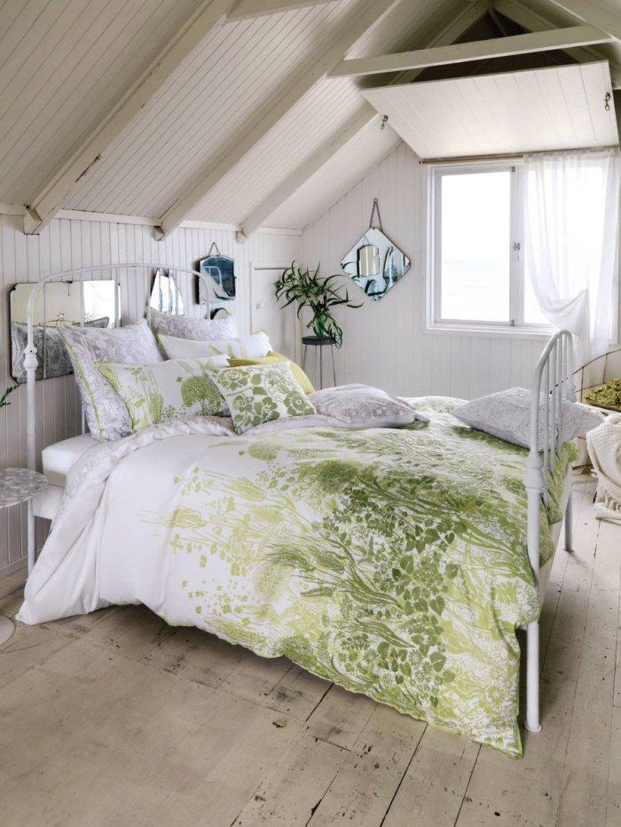 Pale white bedroom - with leaves patterned sheets