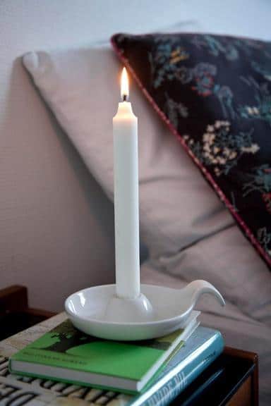 White candle - placed near the bed