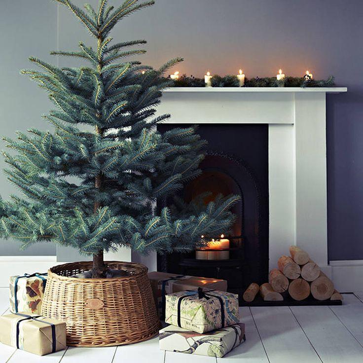 Wicker Christmas tree skirt 6 - next to a fireplace