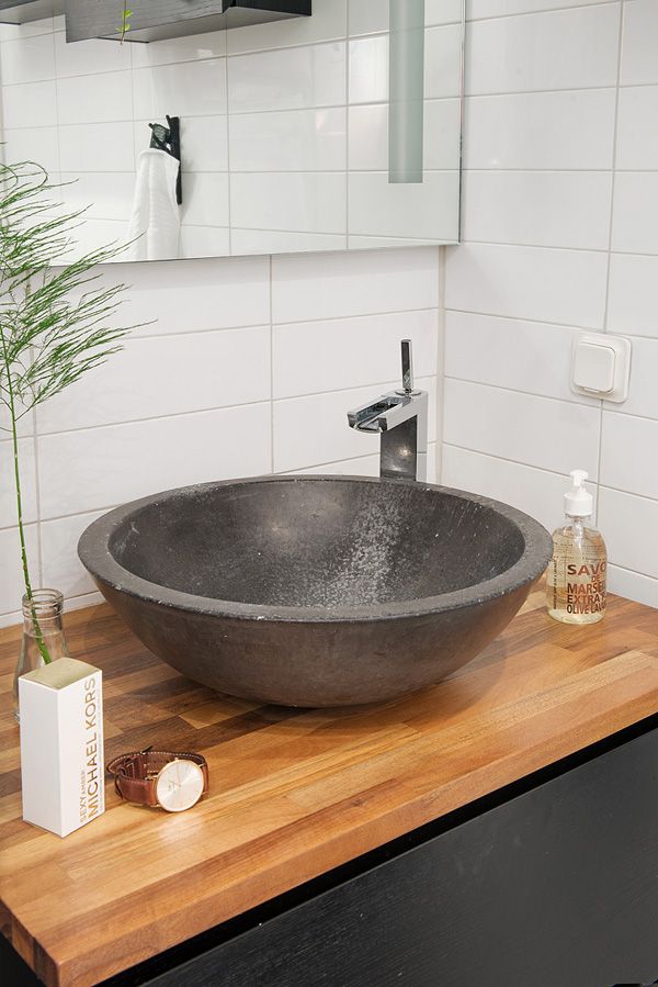 Wooden bathroom basin countertop - with dark bowl above it