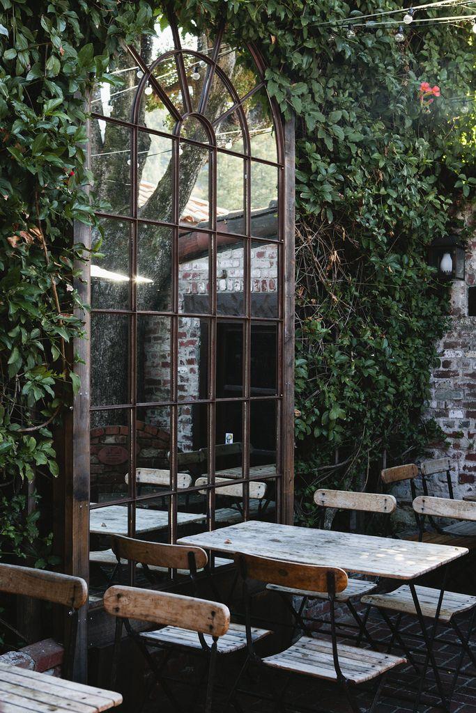 Outdoor cafe garden with greenery