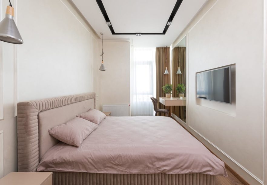Comfortable bedroom in modern flat