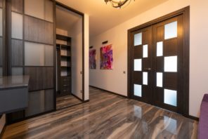Modern room interior with wardrobe on laminate at home